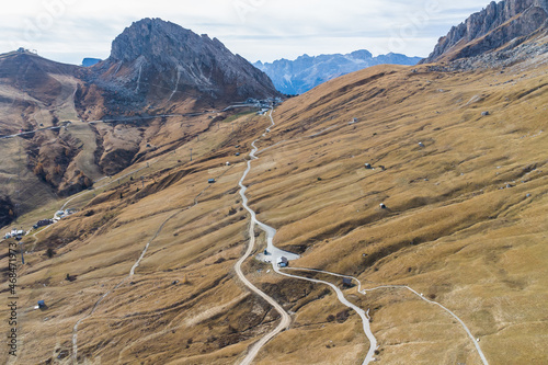 Aerial view of Passo Pordoi mountain pass road in the italian Dolomites near Cortina d'Ampezzo during autumn photo