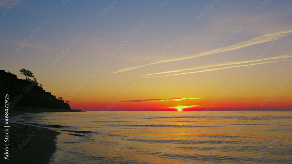 Panorama peaceful ocean coastline with mountain silhouette. Sea horizon skyline