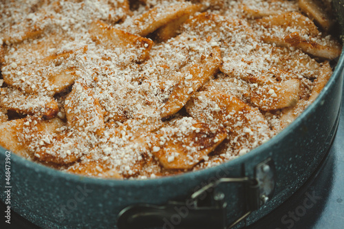 Close-up of raw apple pie in baking dish
