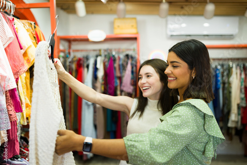 Multiracial friends buying at the thrift store