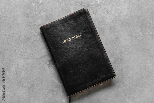 Black Holy Bible on grunge background