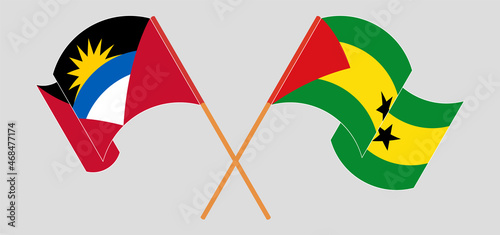 Crossed and waving flags of Antigua and Barbuda and Sao Tome and Principe