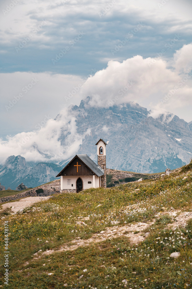 Small church in Tre Cime Di Lavaredo, Dolomites, Italian alps with mountains in background