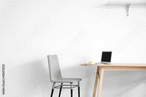 Stylish workplace near wall in room © Pixel-Shot