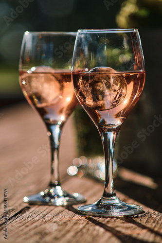 Two glasses of rose wine with ice cubes. High quality photo