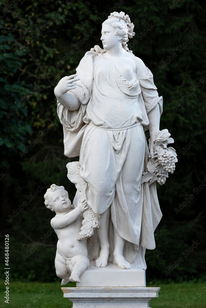 Marble statue of Earth in the garden of Bacchus in the Lower Park, Saint Petersburg, Russia