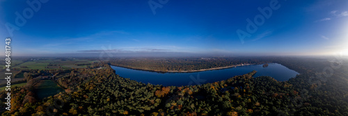 View from above horse head shaped De IJzeren Man lake surrounded by autumn forest with beaches on its shores. Aerial Dutch panorama landscape scenery. © Maarten Zeehandelaar