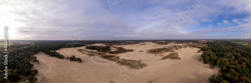 Wide aerial panorama of Loonse en Drunense Duinen sand dunes in The Netherlands. Unique Dutch natural phenomenon of sandbank drift plain seen from above.  photo