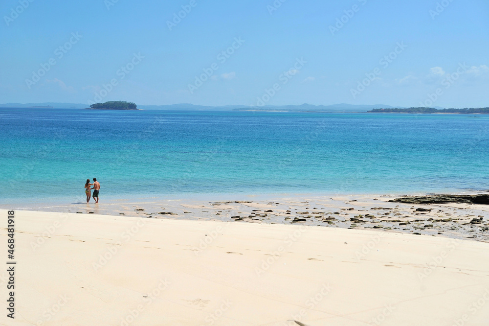 Young couple on a beach on a small islet in Las Perlas islands, Panama