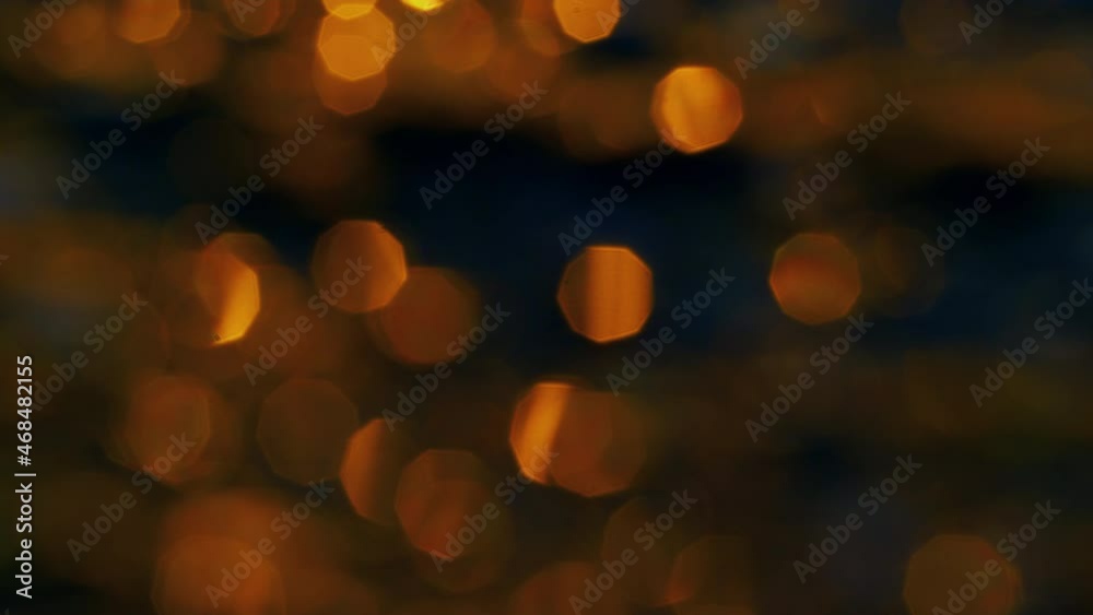Abstract blurred lights sparking on water surface at golden sunrise. Sun light Abstract blurred lights sparking on water surface at golden sunrise. Sun light