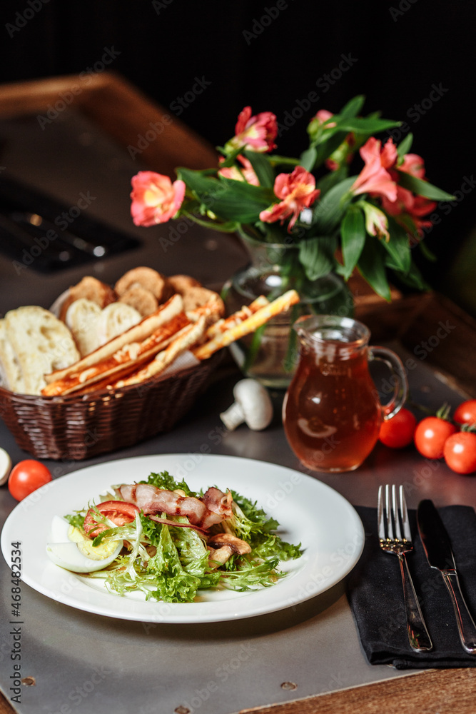 Light salad with vegetables bacon cherry grilled mushrooms tomatoes egg. delicious summer lunch Light salad with vegetables bacon cherry grilled mushrooms tomatoes egg. delicious summer lunch
