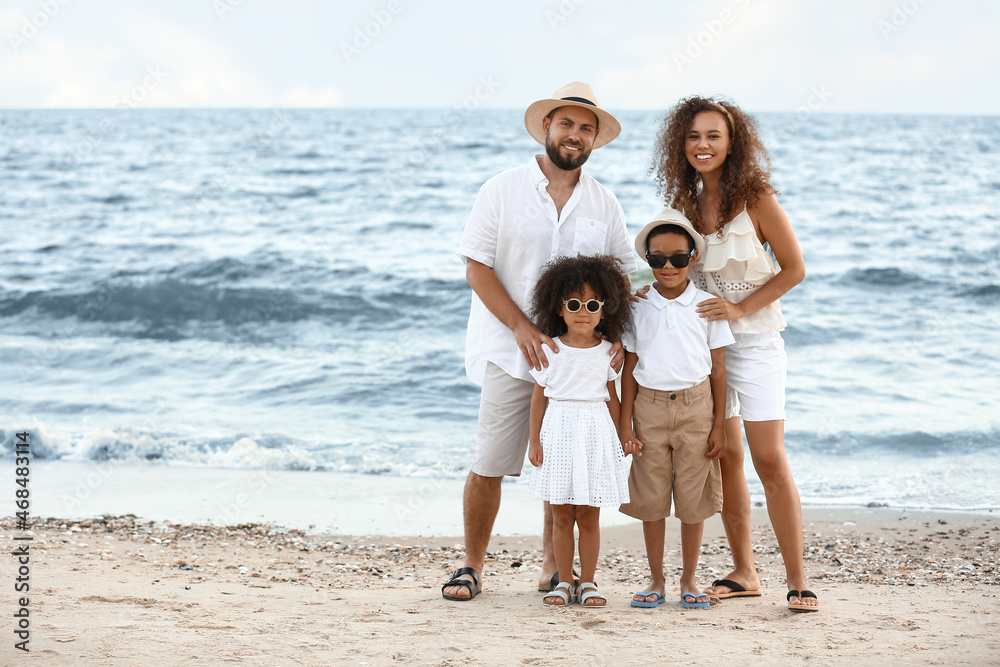 Happy family on sea beach