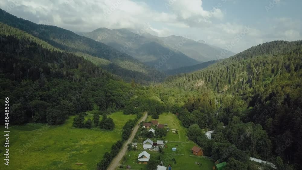 Top view of small wooden houses in a mountainous area. Beautiful landscapes Top view of small wooden houses in a mountainous area. Beautiful landscapes
