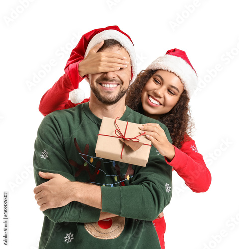 Happy couple in Santa hats ...