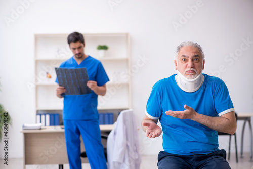 Old male patient visiting young male doctor radiologist