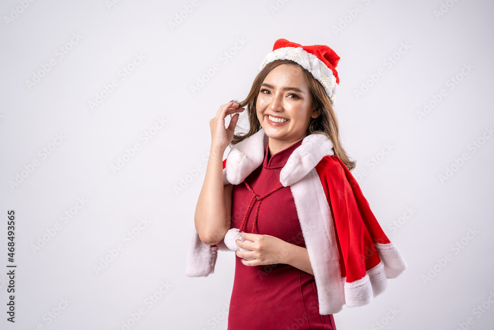 Happy Christmas beauty woman wears red shirt isolated on white background,Santa's helper,Dress and Santa's hat. Happy Christmas beauty woman wears red shirt isolated on white background,Santa's helper,Dress and Santa's hat.