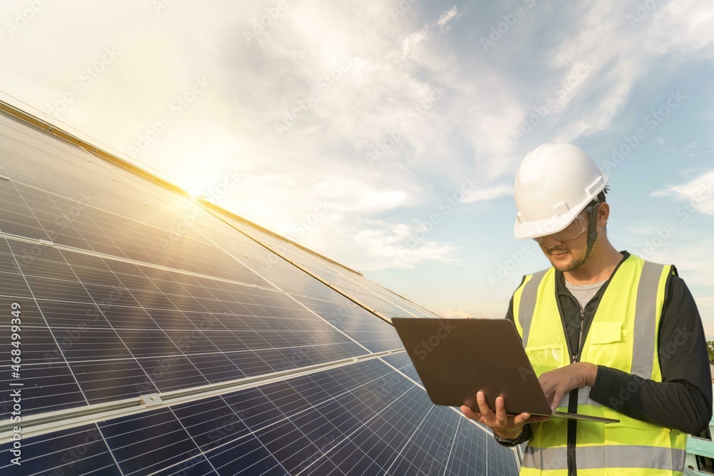 Engineering working test and checking and maintenance in solar power plant by Notebook computer.operation and maintenance in solar power plant to innovation of green energy for life Engineering working test and checking and maintenance in solar power plant by Notebook computer.operation and maintenance in solar power plant to innovation of green energy for life