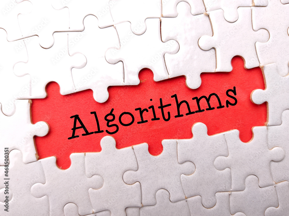 White puzzle with text Algorithms on a red background. White puzzle with text Algorithms on a red background.