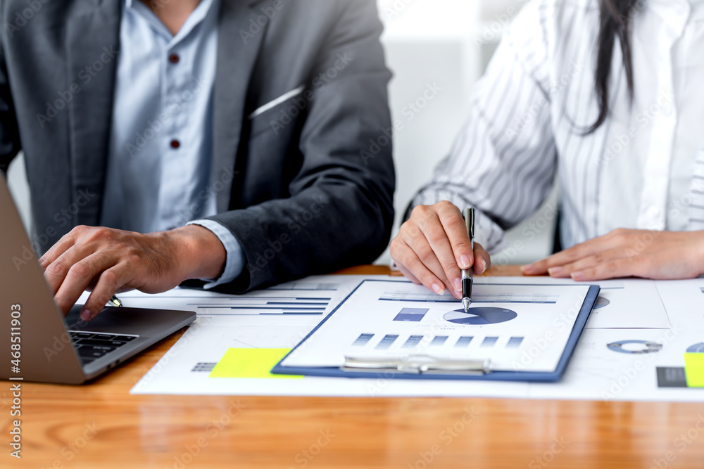 Business people hand pointing at business document during discussion at meeting.. Business people hand pointing at business document during discussion at meeting..