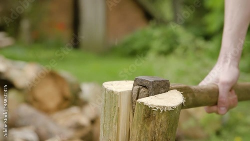 Wallpaper Mural man chopping firewood in the countryside with axe Torontodigital.ca