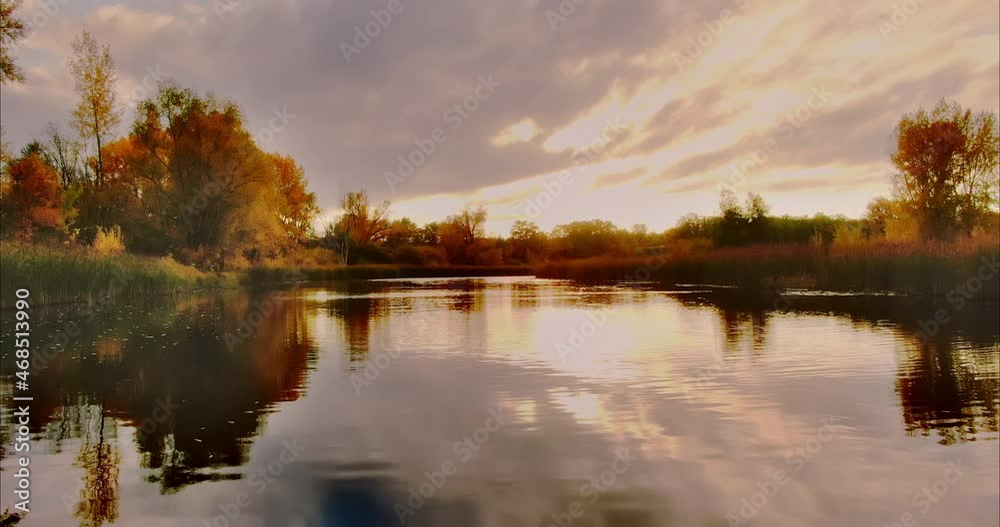Close-up, dark water surface of the river. Rays of the sun, golden foliage of trees and grass are reflected in the water surface of the river. Beautiful autumn landscape in the village. Aerial view Close-up, dark water surface of the river. Rays of the sun, golden foliage of trees and grass are reflected in the water surface of the river. Beautiful autumn landscape in the village. Aerial view