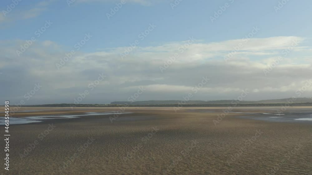 People walking on sandy beach near sea, top down aerial view.Aerial footage of boys exploring beach near sea. People walking on sandy beach near sea, top down aerial view.Aerial footage of boys exploring beach near sea.