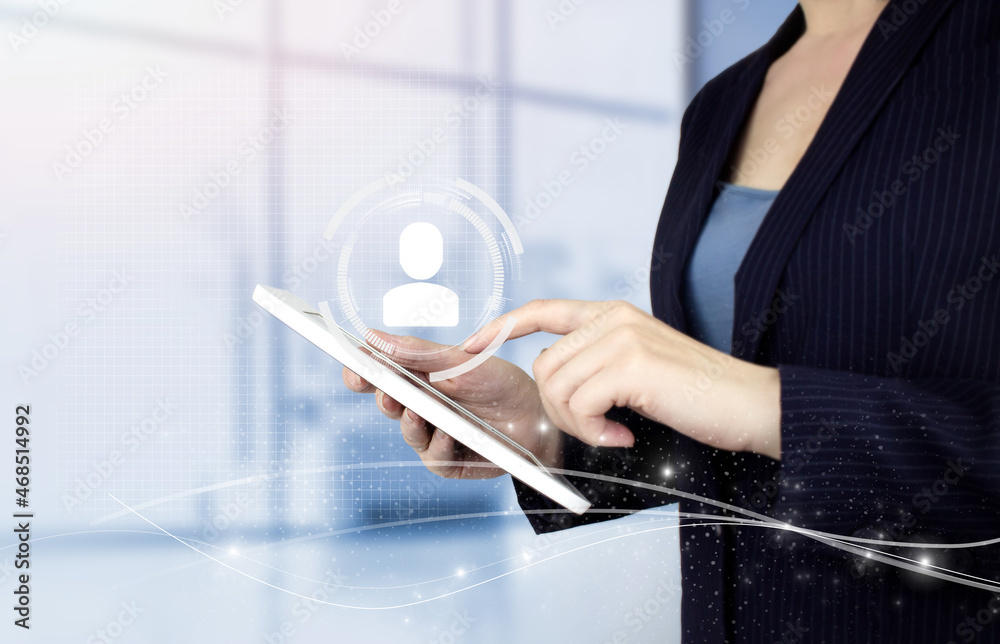 Naklejka premium HR Human Resources Recruitment Employment. Hand touch white tablet with digital hologram Human, Leader sign on light blurred background. Social media concept. Communication network.