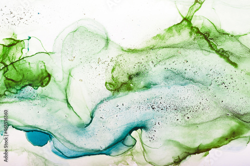 Fototapeta Naklejka Na Ścianę i Meble -  Watercolor alcohol ink swirls. Transparent waves in blue and green colors. Delicate pastel spots. Digital decor