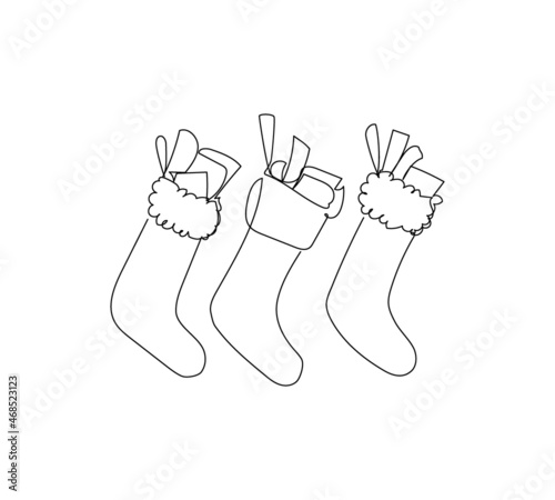 Christmas stockings with gifts one line art. Continuous line drawing of new year holidays, christmas, celebration, traditional, decor, presents, giving, decoration.