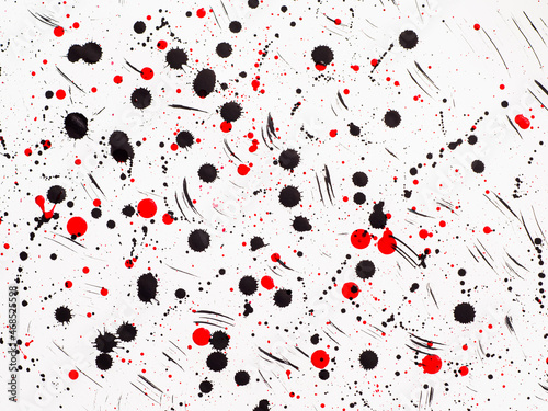 Picture painted using the technique of dripping. Mixing different colors white and black and red