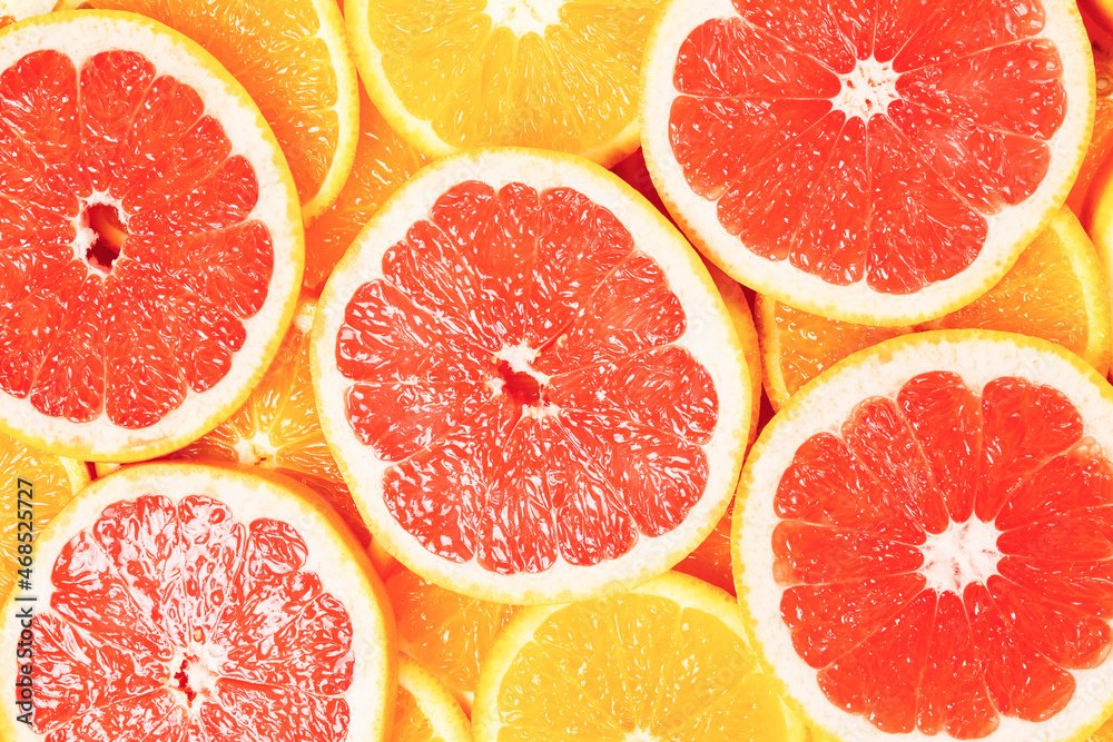 Slices of oranges and a grapefruits as a background. Slices of oranges and a grapefruits as a background.