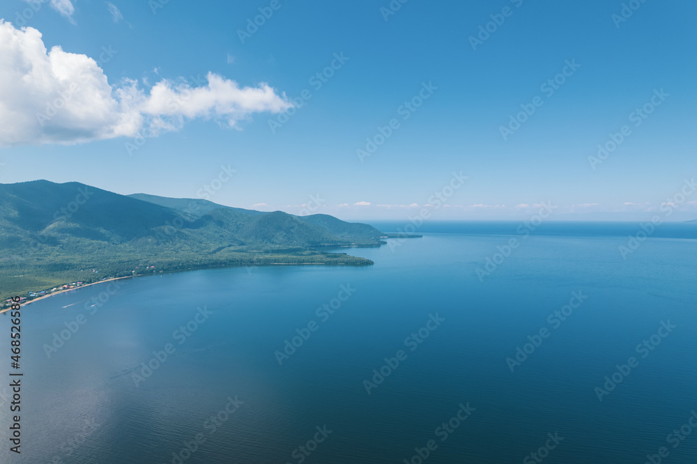 Summertime imagery of Lake Baikal is a rift lake located in southern Siberia, Russia Baikal lake summer landscape view from a cliff near Grandma's Bay. Drone's Eye View. Summertime imagery of Lake Baikal is a rift lake located in southern Siberia, Russia Baikal lake summer landscape view from a cliff near Grandma's Bay. Drone's Eye View.