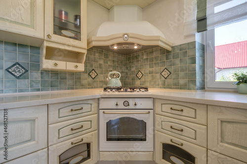 Interior of the modern luxure kitchen in studio apartments with light color