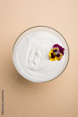 Bowl of white plain yogurt set for breakfast