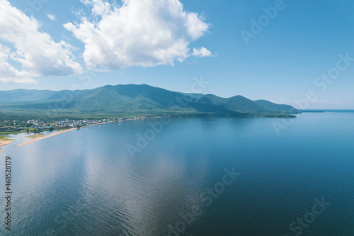 Fantastic panorama of Lake Baikal at sunrise is a rift lake located in southern Siberia, Russia. Baikal lake summer landscape view. Drone's Eye View.