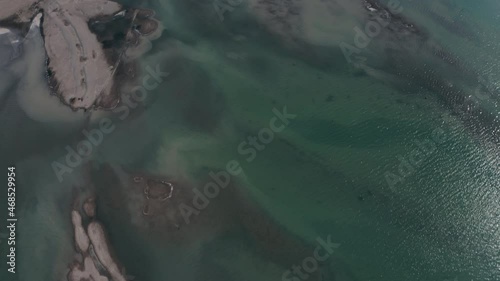 Aerial view over pools on a partly dried lake in Fussen, Germany - tilt, drone shot photo