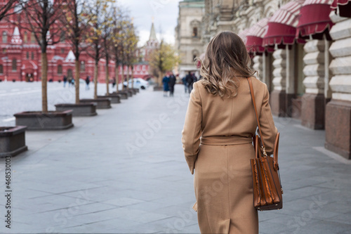 Canvas Print A woman walks along the Gum in Red Square