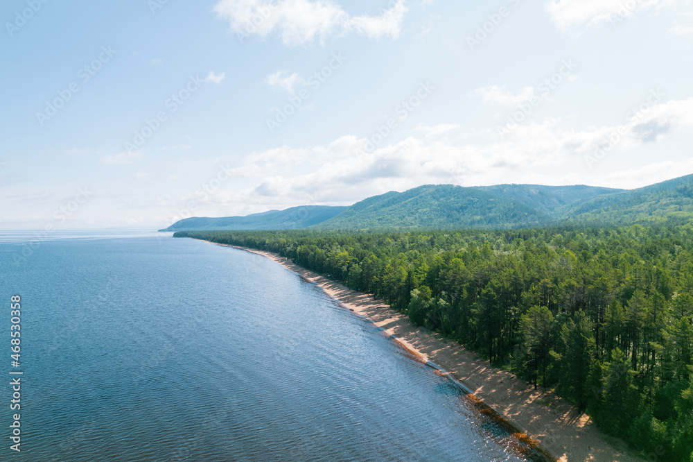 Summertime imagery of Lake Baikal is a rift lake located in southern Siberia, Russia Baikal lake summer landscape view from a cliff near Grandma's Bay. Drone's Eye View.
