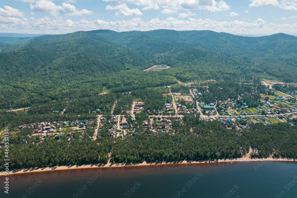 Summertime imagery of Lake Baikal is a rift lake located in southern Siberia, Russia Baikal lake summer landscape view from a cliff near Grandma's Bay. Drone's Eye View.