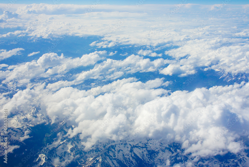 Flying over the mountains with clouds