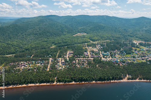 Summertime imagery of Lake Baikal is a rift lake located in southern Siberia  Russia Baikal lake summer landscape view from a cliff near Grandma s Bay. Drone s Eye View.