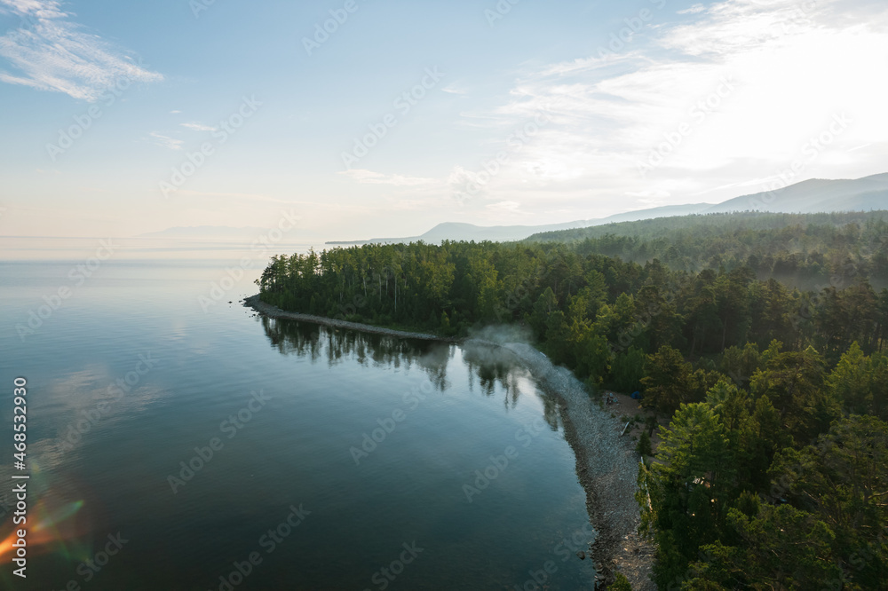Summertime imagery of Lake Baikal in morning is a rift lake located in southern Siberia, Russia. Baikal lake summer landscape view. Drone's Eye View.