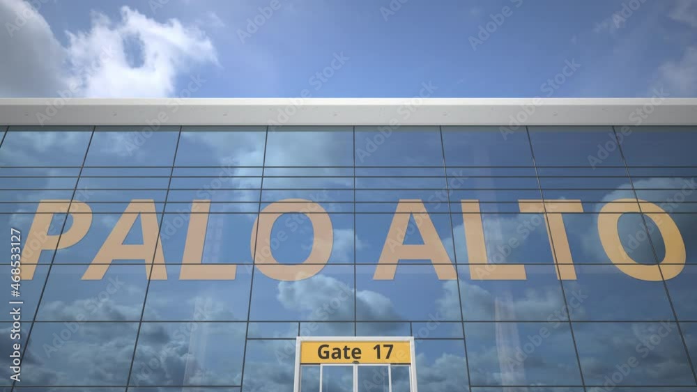 Airliner reflecting in the windows of airport terminal with PALO ALTO text Airliner reflecting in the windows of airport terminal with PALO ALTO text