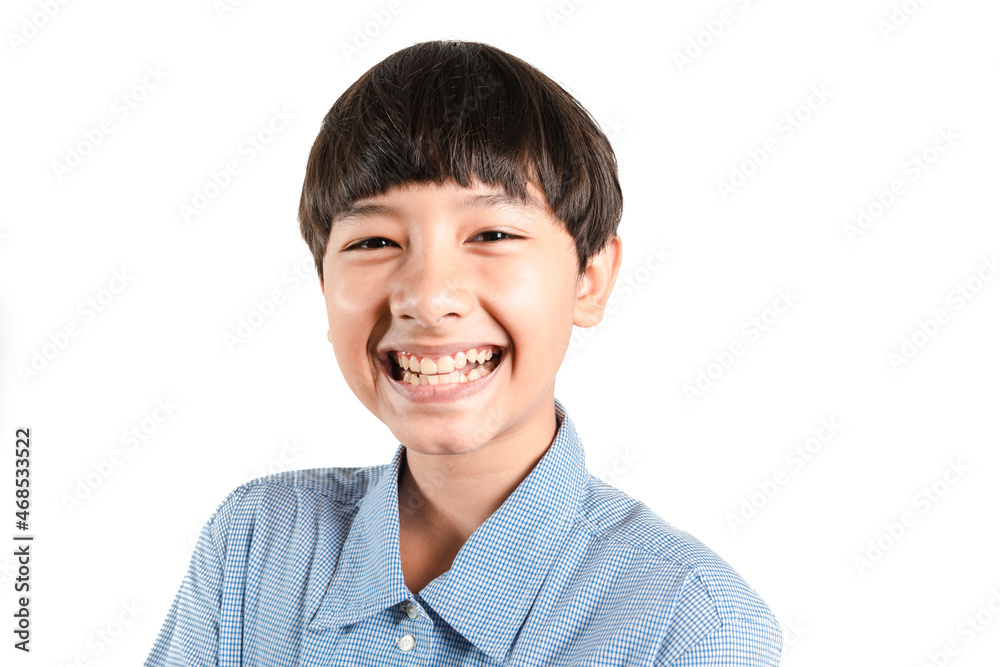 Portrait of adorable young happy smiling mixed race boy looking at camera wearing a casual school look in a good mood, carefree childhood. Isolated on white background for copy space and graphics Portrait of adorable young happy smiling mixed race boy looking at camera wearing a casual school look in a good mood, carefree childhood. Isolated on white background for copy space and graphics