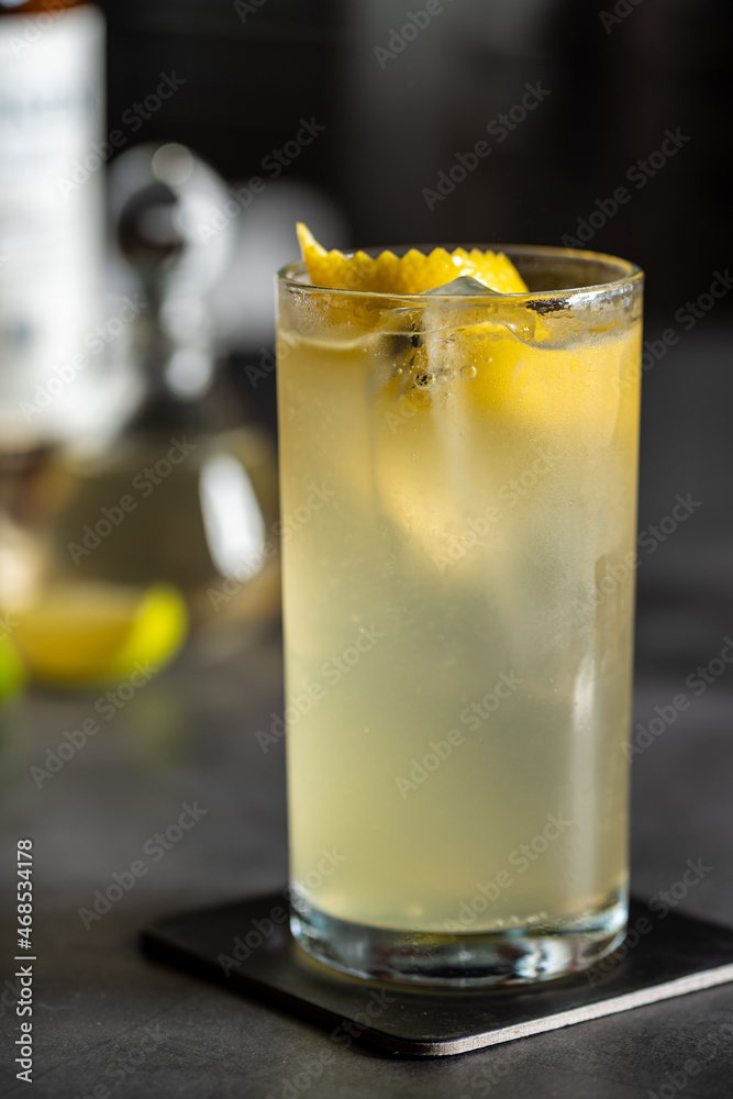 Luxury cocktail with lemon and tequila on a dark stone background Luxury cocktail with lemon and tequila on a dark stone background