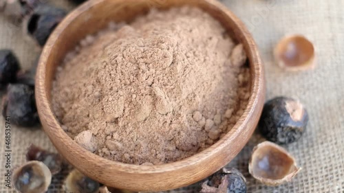 pile of ground soap nut powder for ecological washing. The raw fruit arita or rita, also known as soap nuts, is the main ingredient in any soap and shampoo. photo