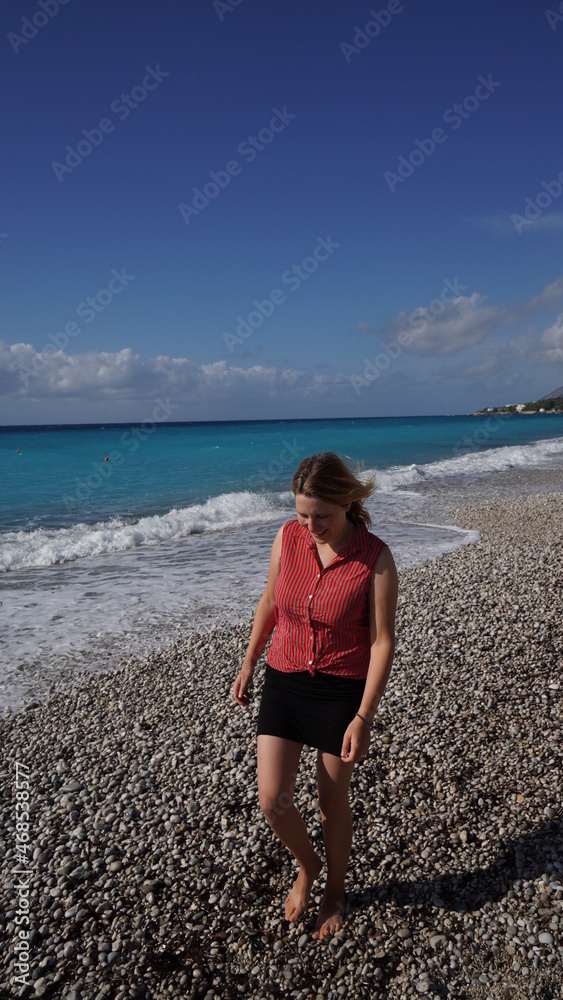 girl strolling at Livadi Beach, Albania