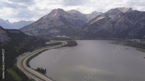 TransCanada Highway passes mountain lake, industrial plant in Rockies photo