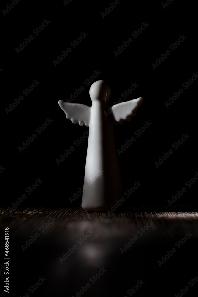 white angel figurine, religious symbols white angel figurine, religious symbols