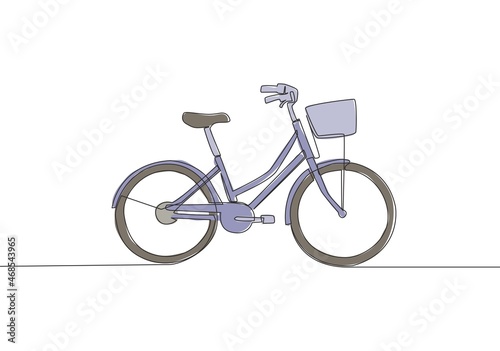One single line drawing of girly classic roadster bicycle logo. Bike with basket at the front concept. Continuous line draw design vector illustration